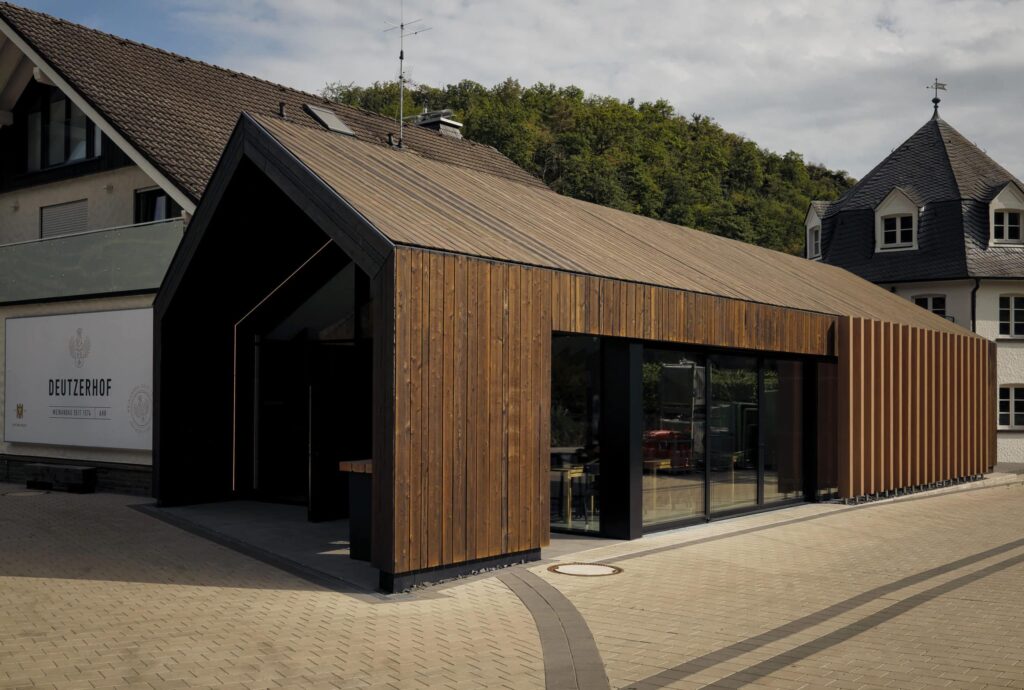 Winery with wooden vinotheque and trees in the background