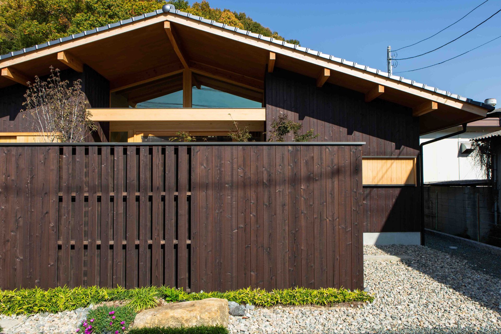 Japanese house with dark brown cladding wood
